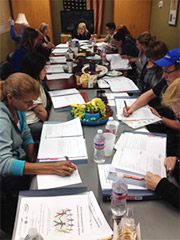 Great Falls CBOC Primary care team members reviewing a case study, at the Vet Center in Great Falls, MT, May 2014